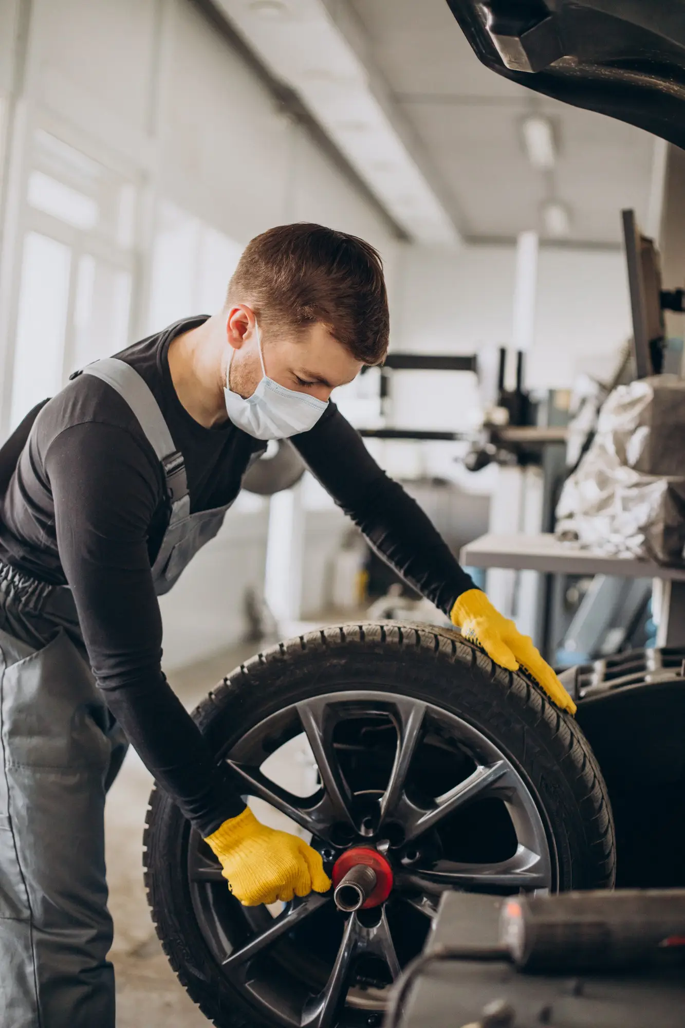 Technician fitting a car tyre in Reading