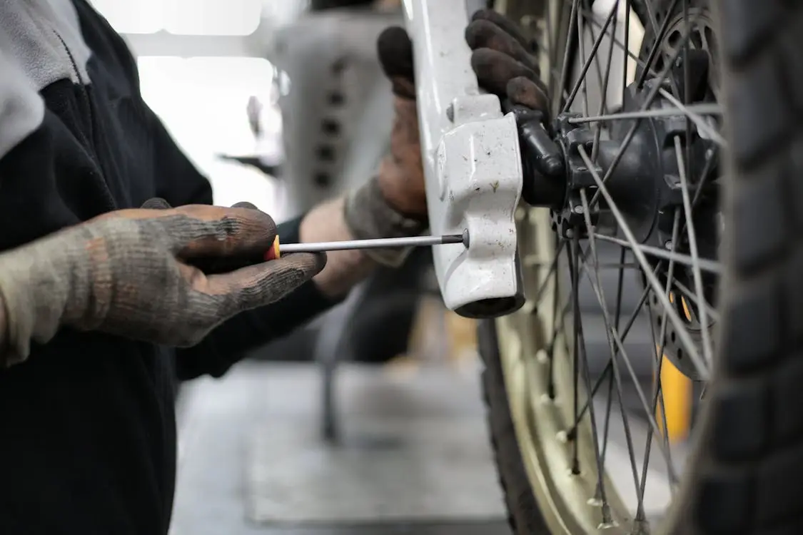 Mobile tyre technician installing tyre