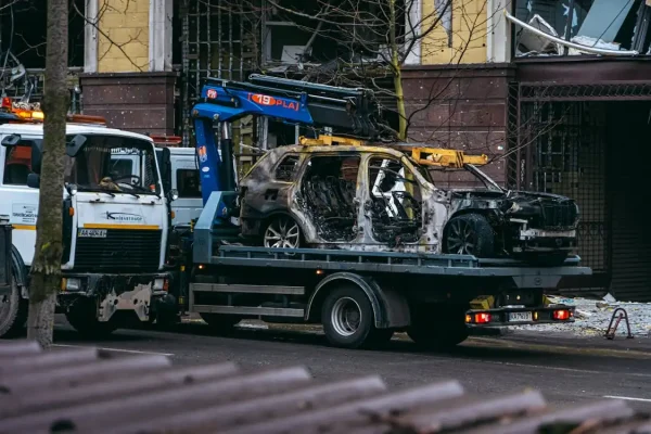 Van recovery truck transporting damaged vehicle